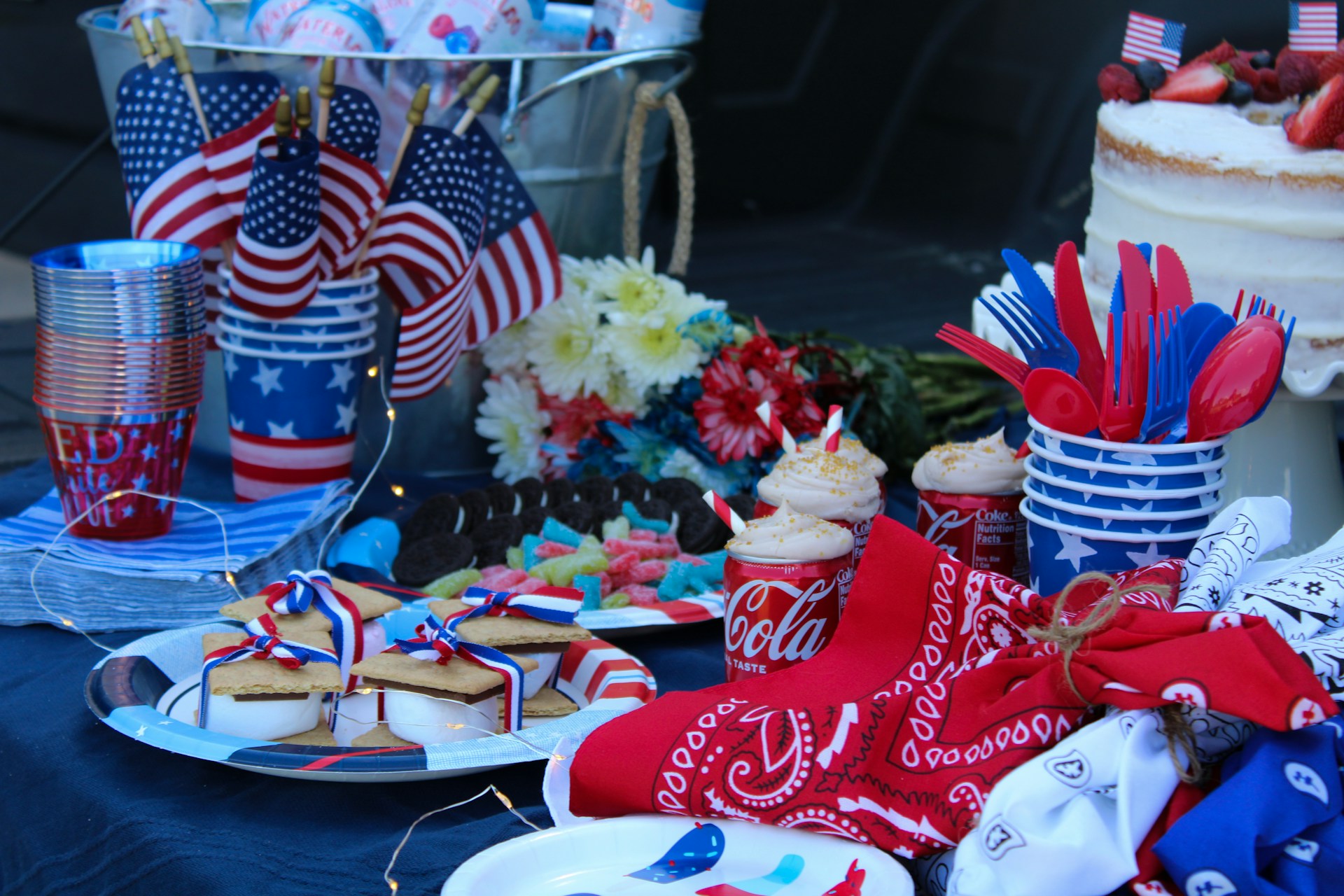 a table full of 4th of july decorations and food