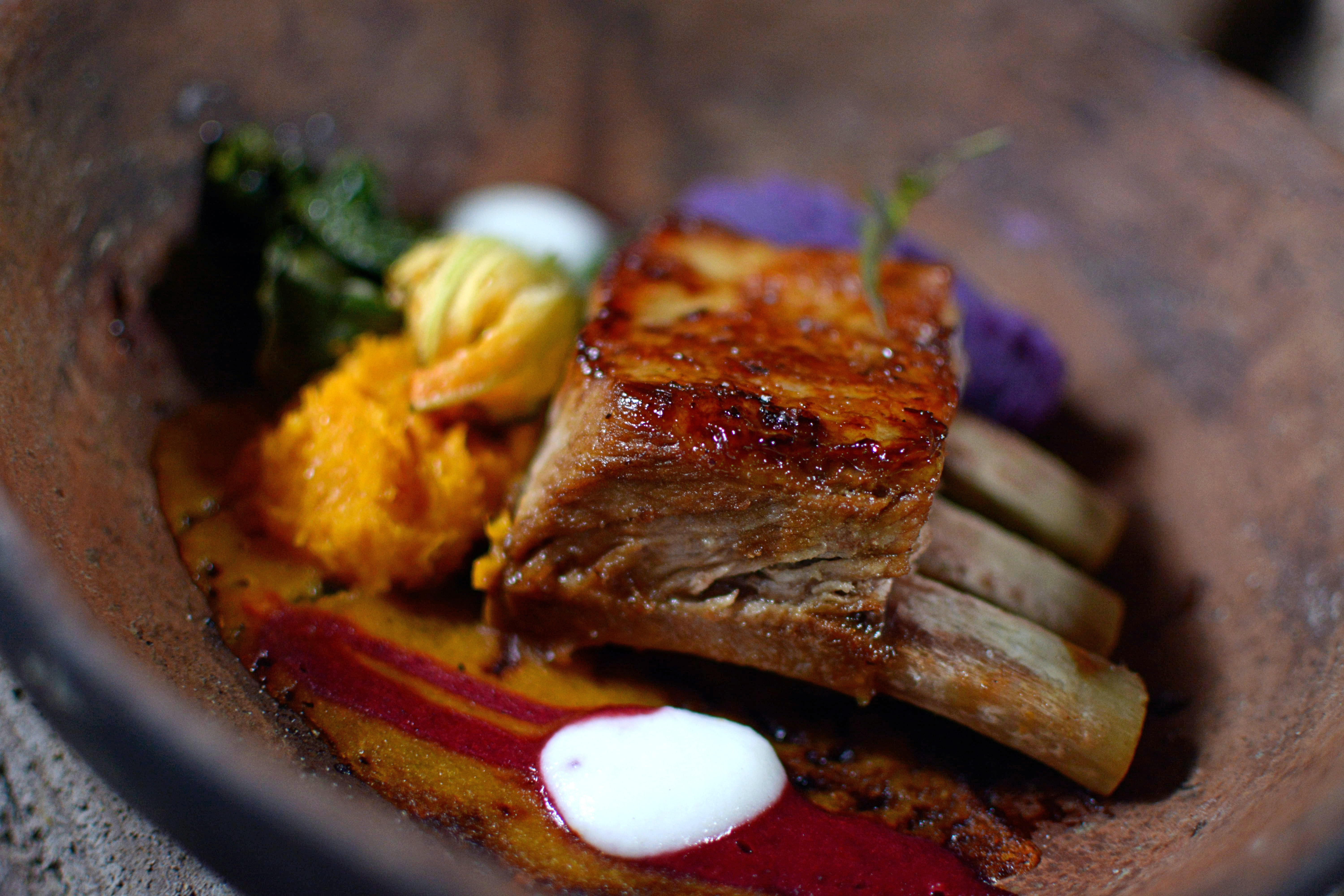 steak with bones on a wooden plate